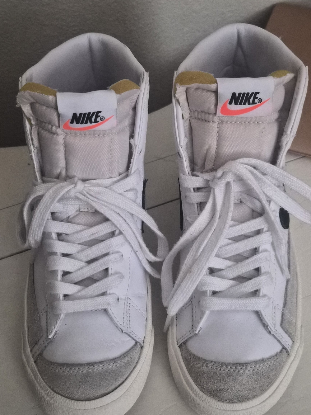 Nike White High-Top Sneakers with Coral Swoosh Tag